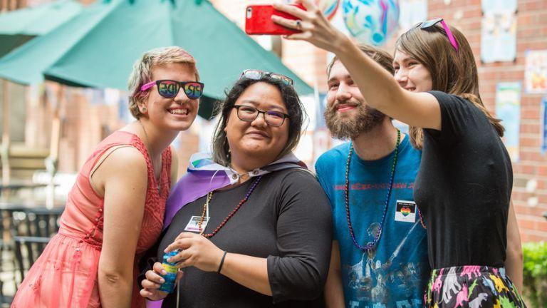 Students taking a selfie during Pacific's Pride celebration