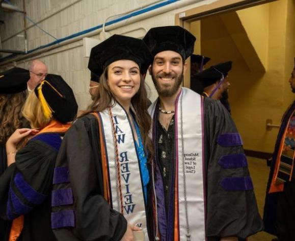海登杰克逊, ’21, 和阿利亚·戈雷利克, '21, participate in 麦克乔治法学院's graduation ceremony